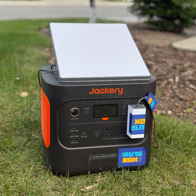 Jackery portable power station with solar panel on grass